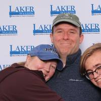 Family of three hugging each other